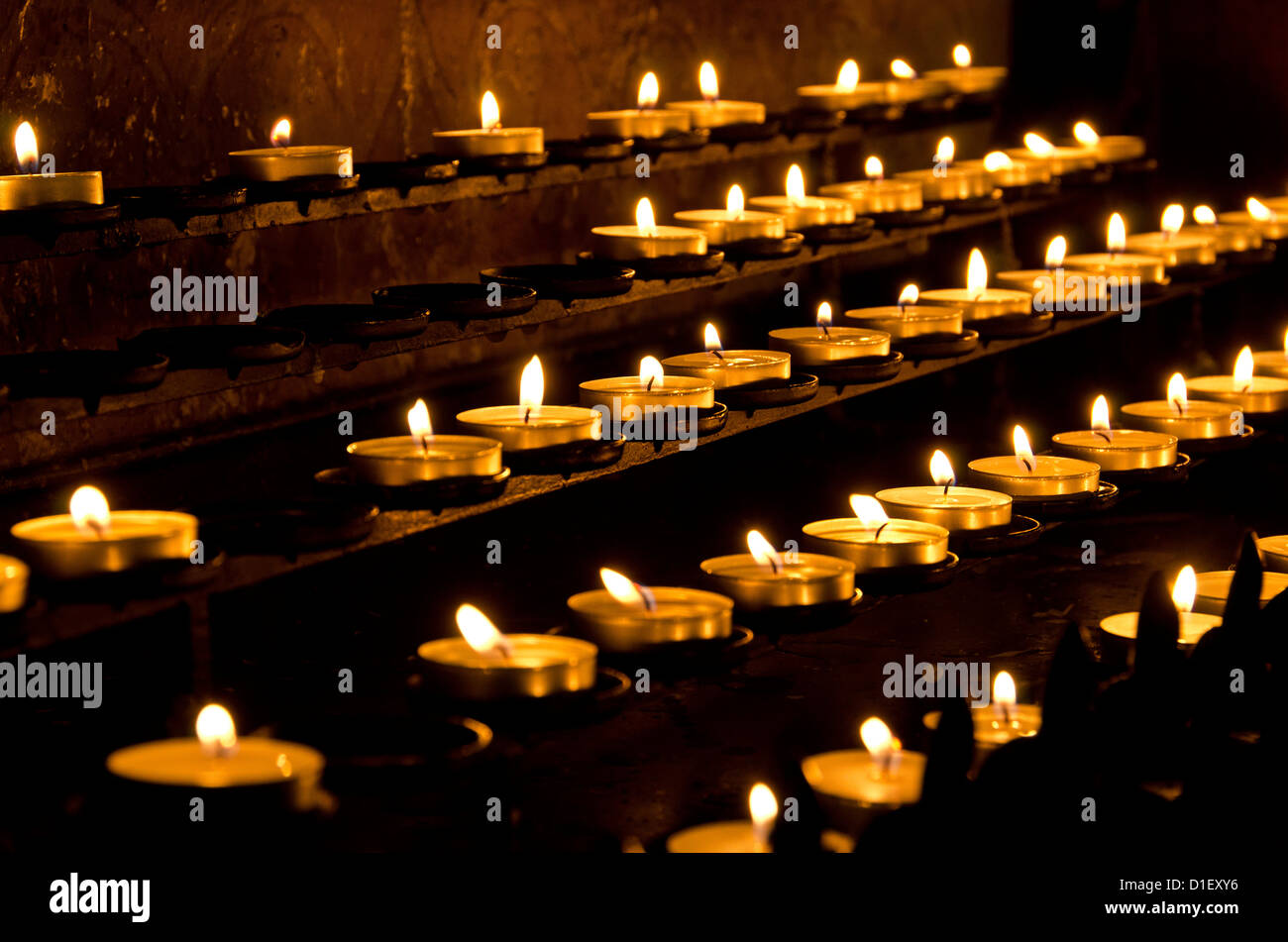 Burning candles in a church Stock Photo Alamy