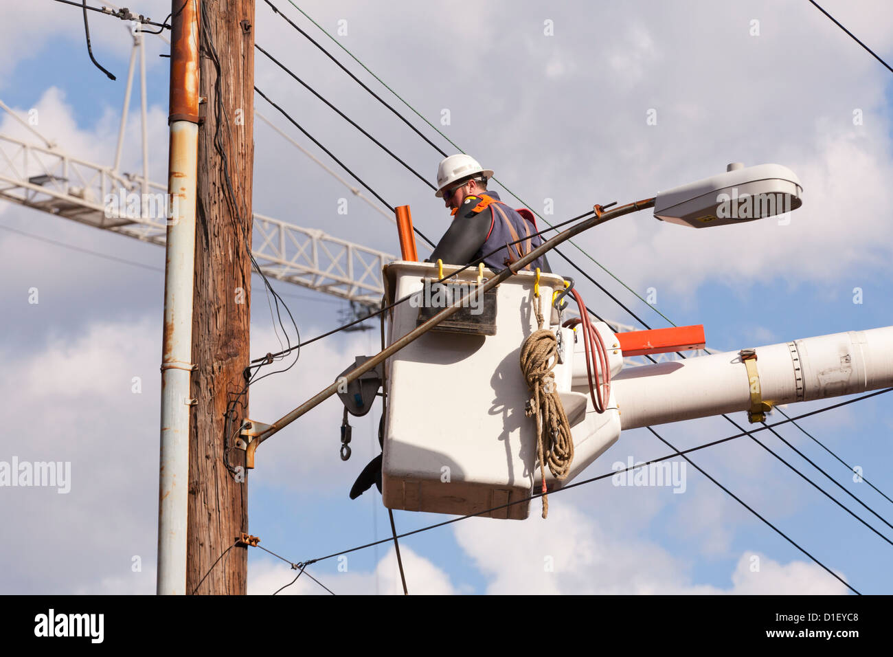 Lineman working on electric line USA Stock Photo Alamy