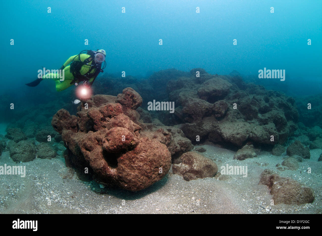 Diver with rocks, Caesarea Maritima, Mediterranean Sea, Israel ...