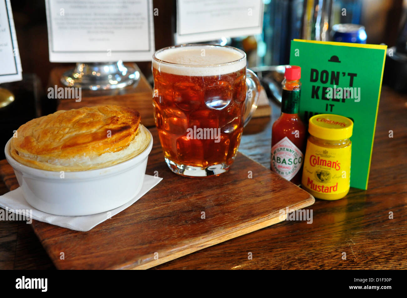 Pint of Ale and a Pie at The Draft House Pub, Northcote Road, Clapham, London, England, SW11 Stock Photo