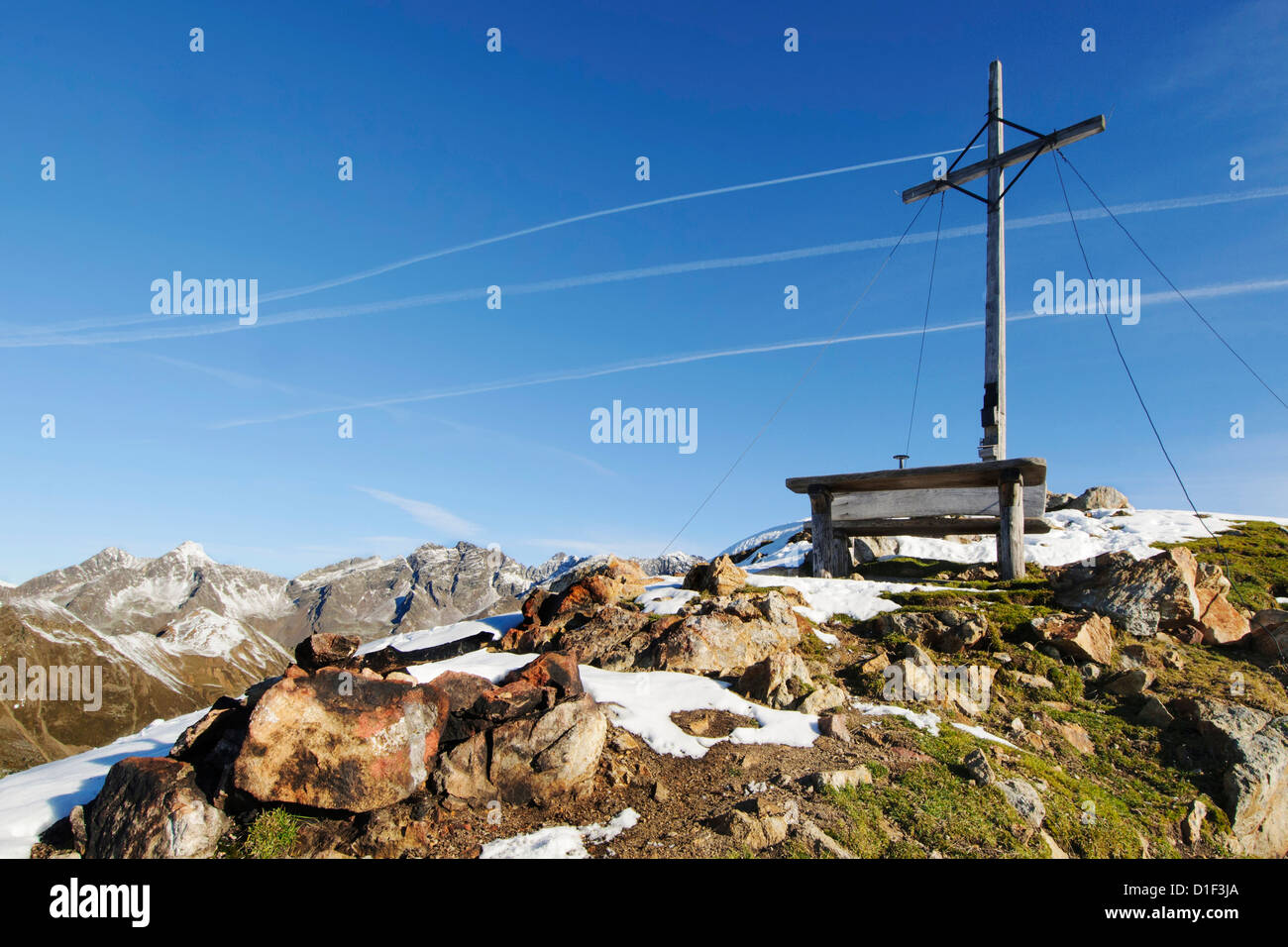 Mountainscape with summit cross in the Rieserferner-Ahrn Nature Park, South Tyrol, Italy Stock Photo