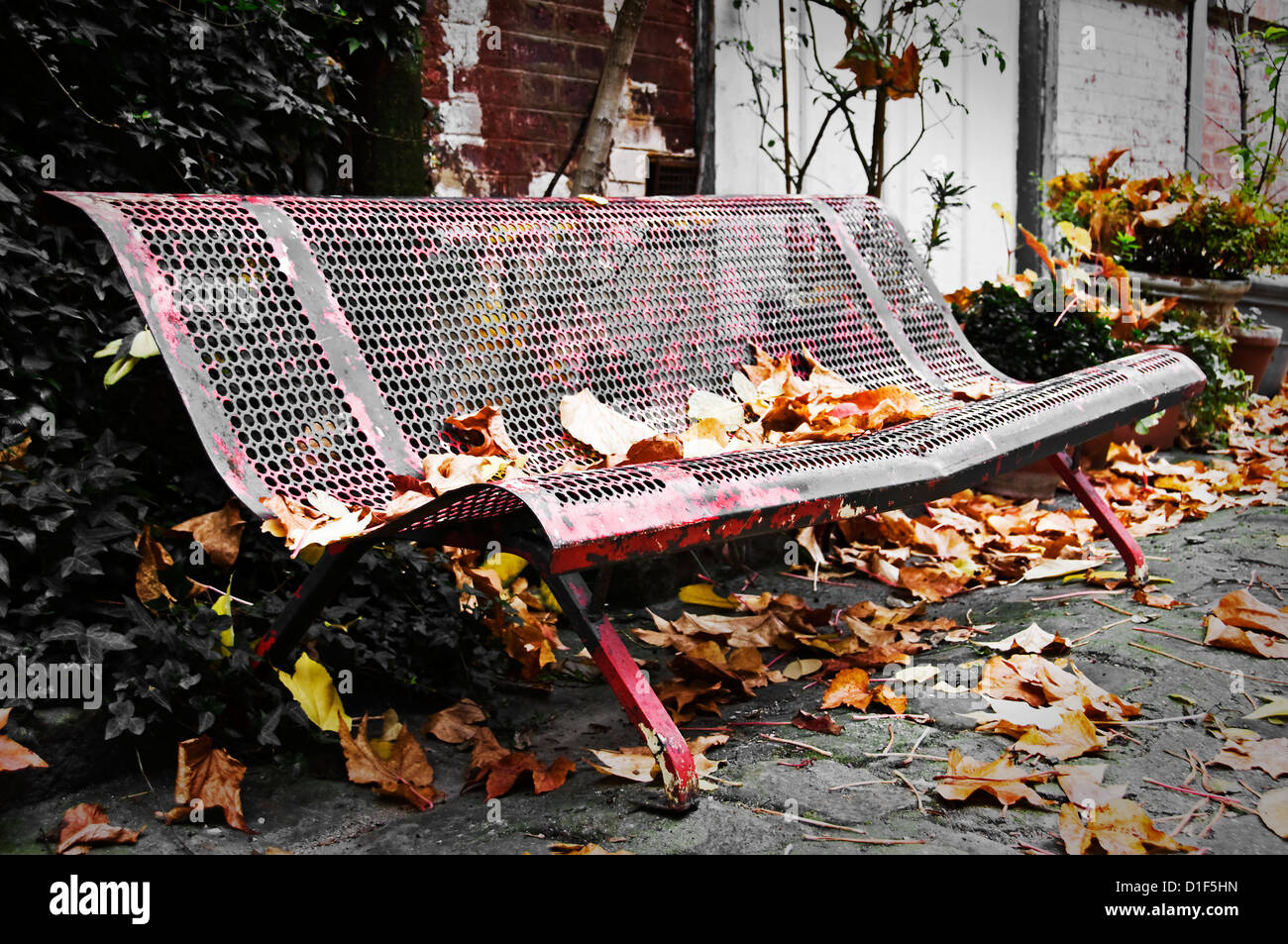 Old bench in a paved artist alley close to the Musée du Montparnasse - Villa Marie Vassilieff, Paris, France Stock Photo