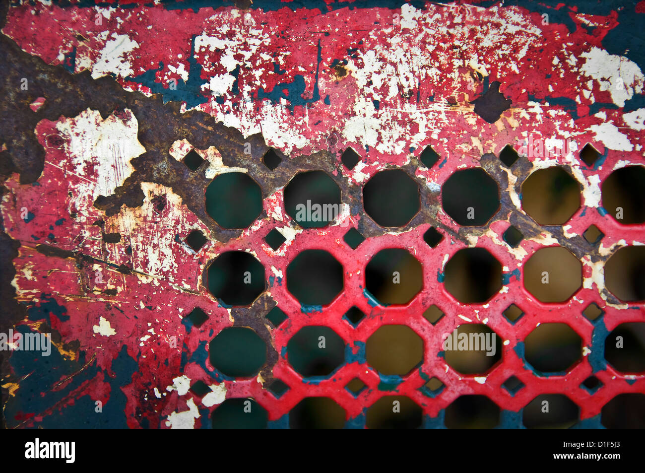 Closeup of an old red metallic bench Stock Photo
