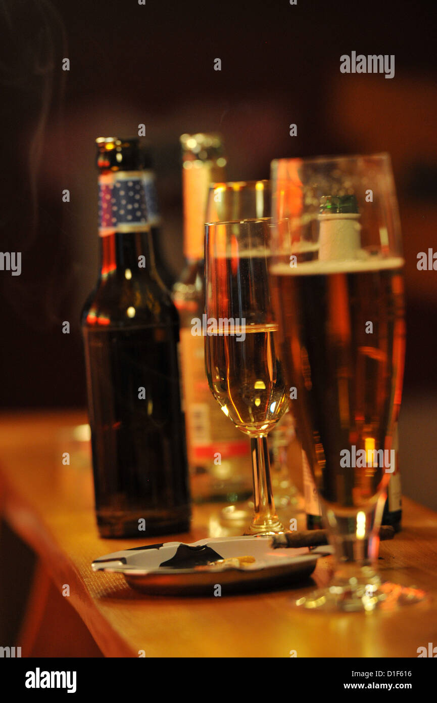 Glasses with Alcohol are standing on the counter of a bar during a party. Photo: Frank May Stock Photo