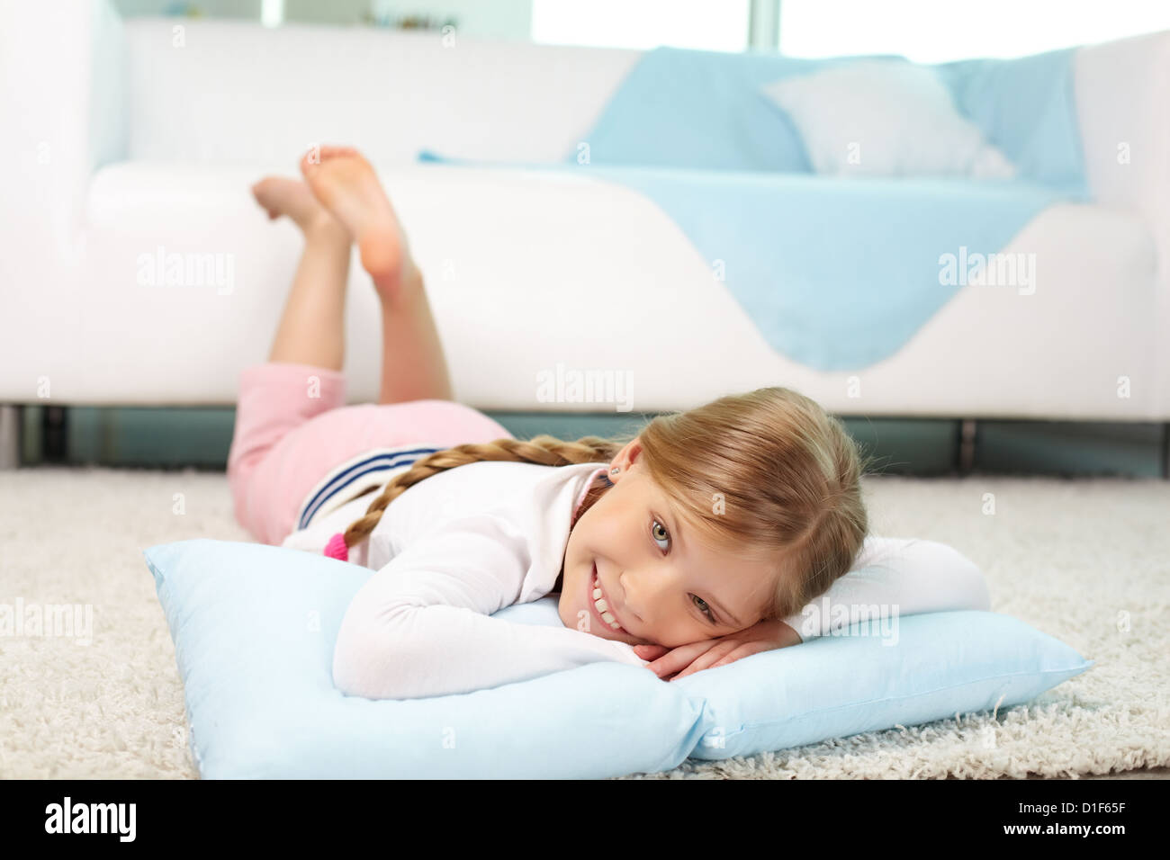 Portrait of lovely girl lying on the floor at home Stock Photo - Alamy