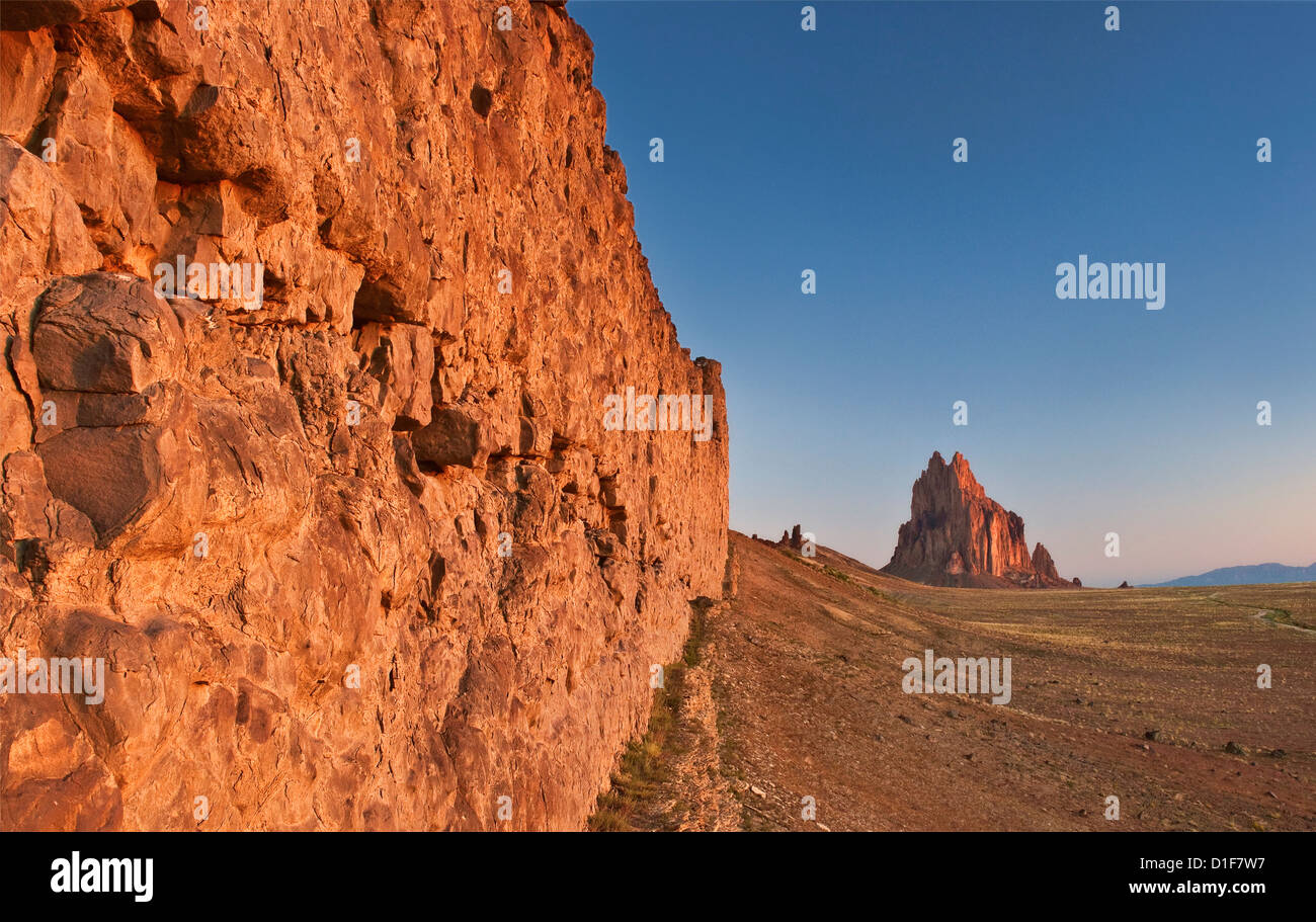 Shiprock, sacred Navajo mountain, monolith, dike ridge on left, at sunrise, New Mexico, USA Stock Photo