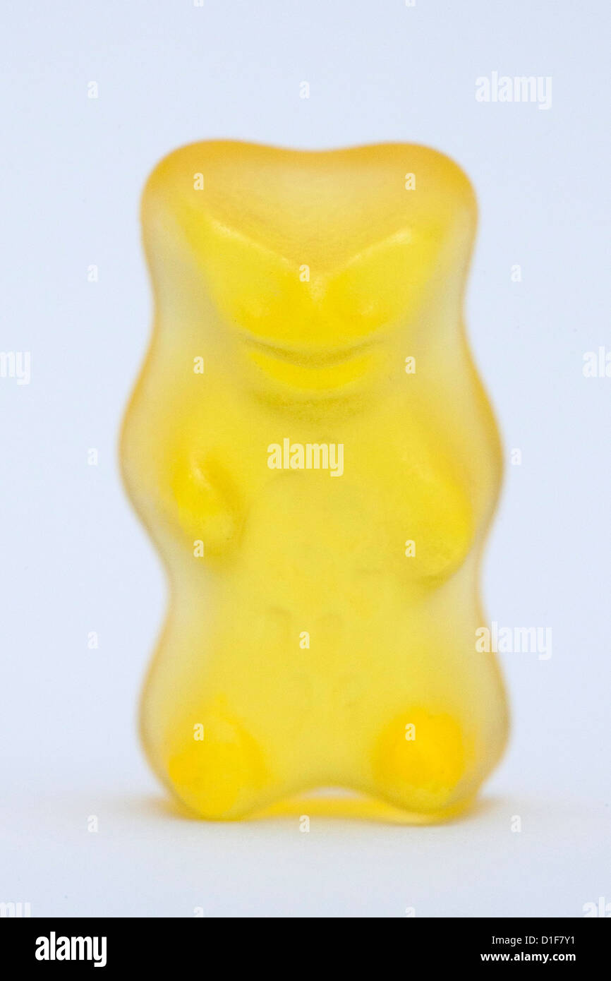 A gold gummy bear made by Haribo stands on a table in Cologne, Germany, 18 December 2012. The verdict is expected today from the court in the trial between Haribo and Lindt on a 'Teddy' wrapped in gold foil by the Swiss chocholate manufacturer. Candy manufacturer Haribo is insisting on the rights of the name 'Goldbaer' ('Gold Bear') and is afraid of the danger of confusion with its yellow bears. Therefore the chocolate 'Teddy' cannot be sold anymore. Photo: Rolf Vennenbernd Stock Photo