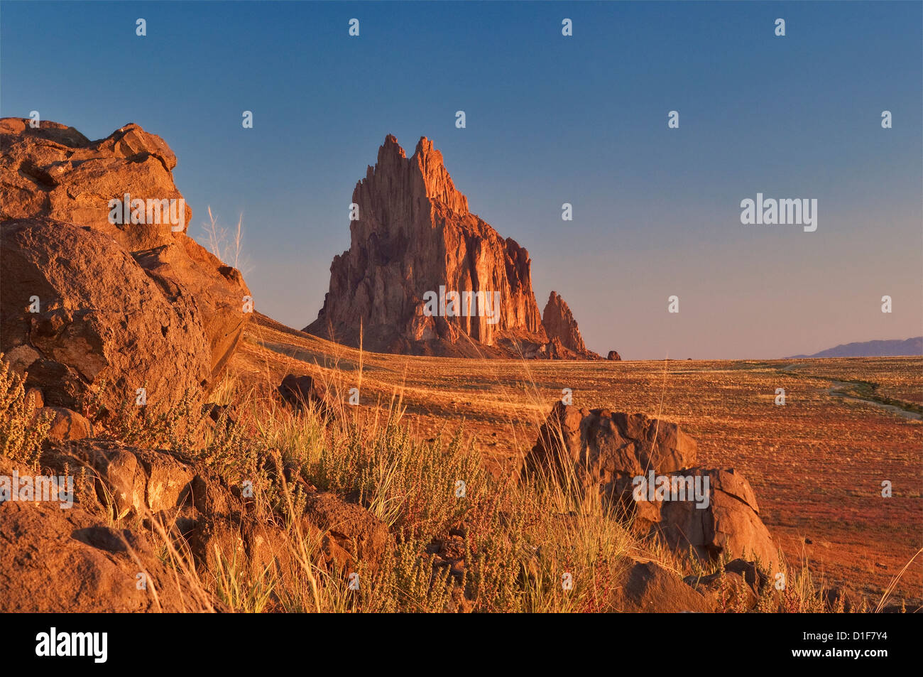 Shiprock, sacred Navajo mountain, dike ridge on left, at sunrise, New