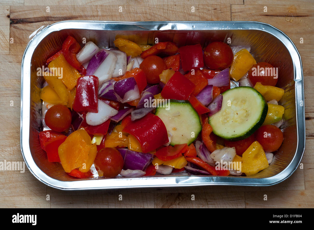 Mixed vegetables in a roasting tin Stock Photo Alamy