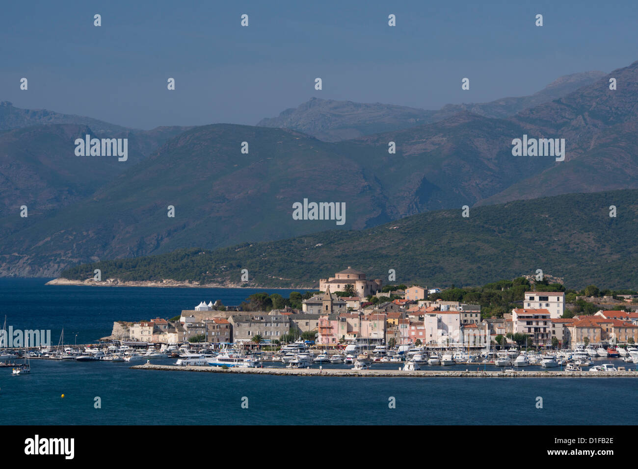 A view of St. Florent and distant mountains in the Nebbio region of nothern Corsica, France, Mediterranean, Europe Stock Photo