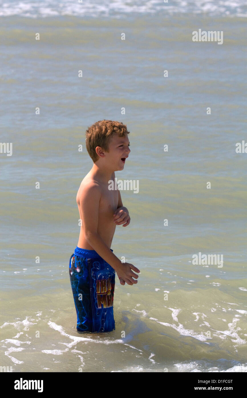 Seven year old boy playing at Madeira Beach in Pinellas County, Florida, USA. Stock Photo