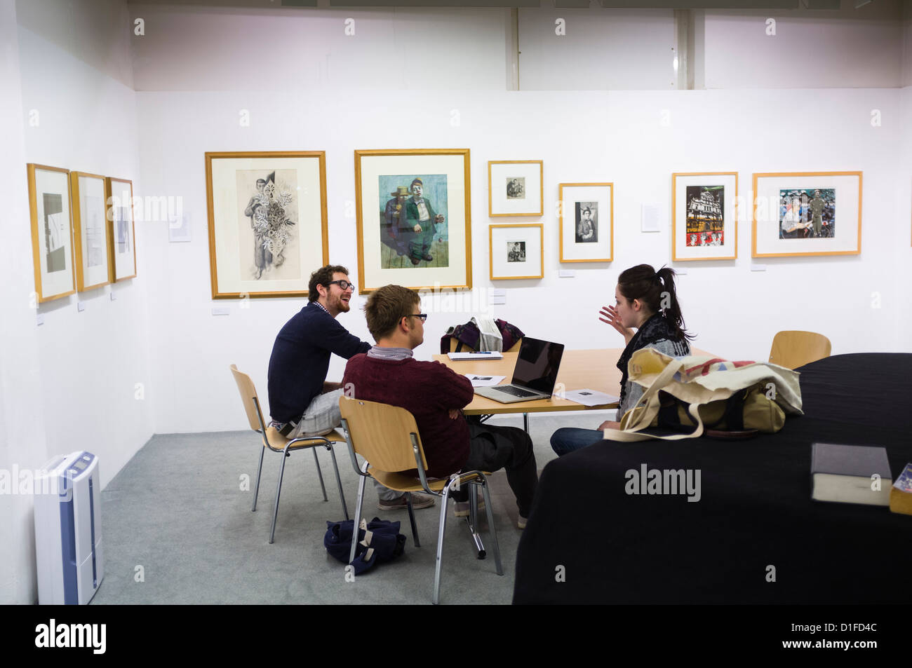 A seminar at Aberystwyth university school of art, students looking at