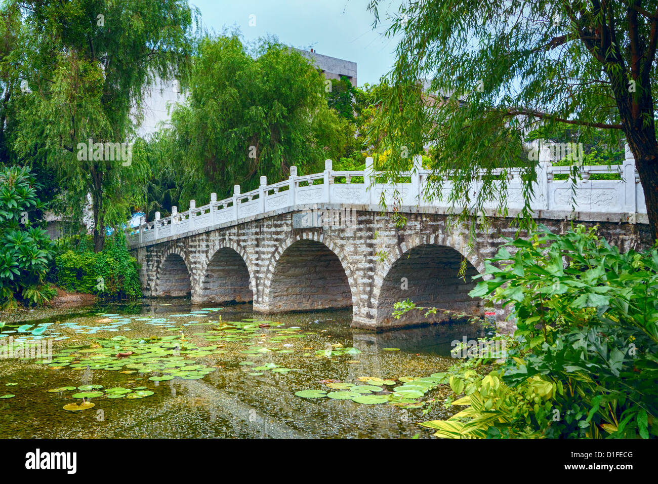 stone bridge in an Asian garden Stock Photo - Alamy