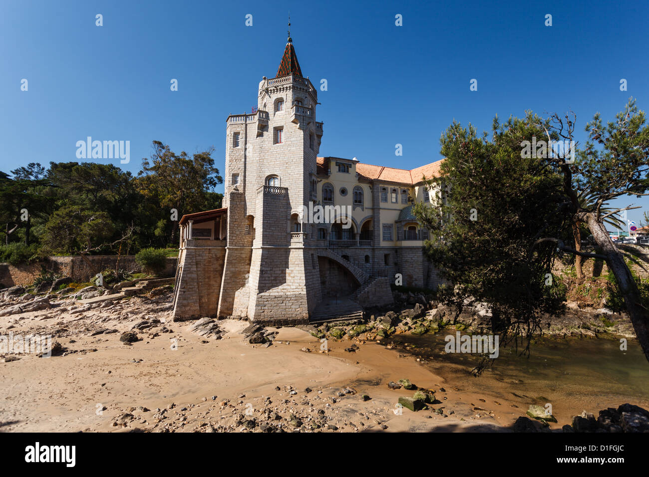 Estoril, Portugal beach with beautiful home with turret and castle tower Stock Photo