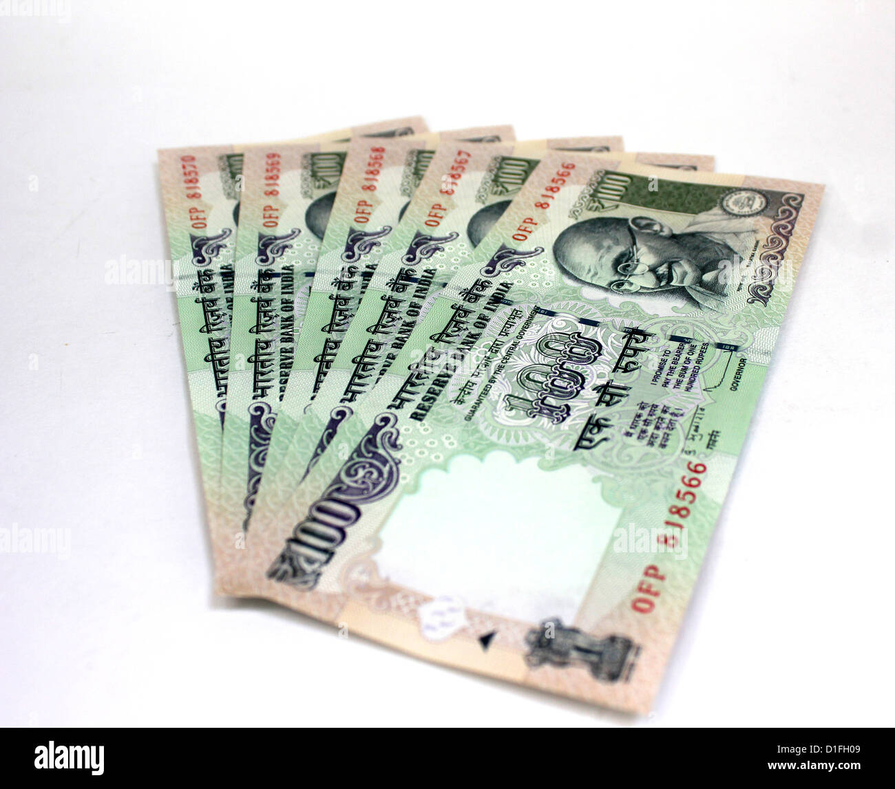 Indian currency A fan of one hundred rupee notes in white background 100 Stock Photo