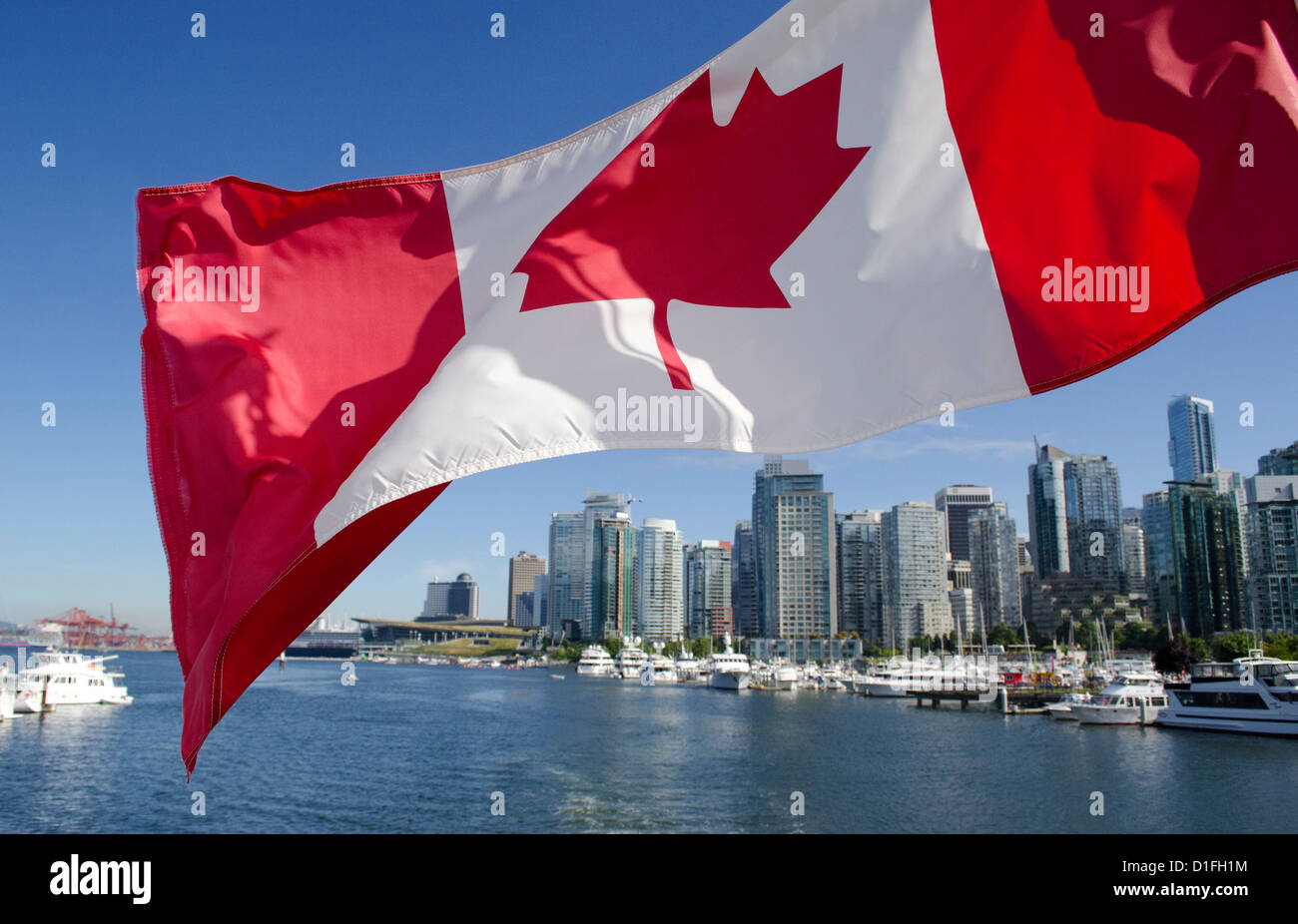 Canadian flag over Vancouver BC waterfront Stock Photo Alamy