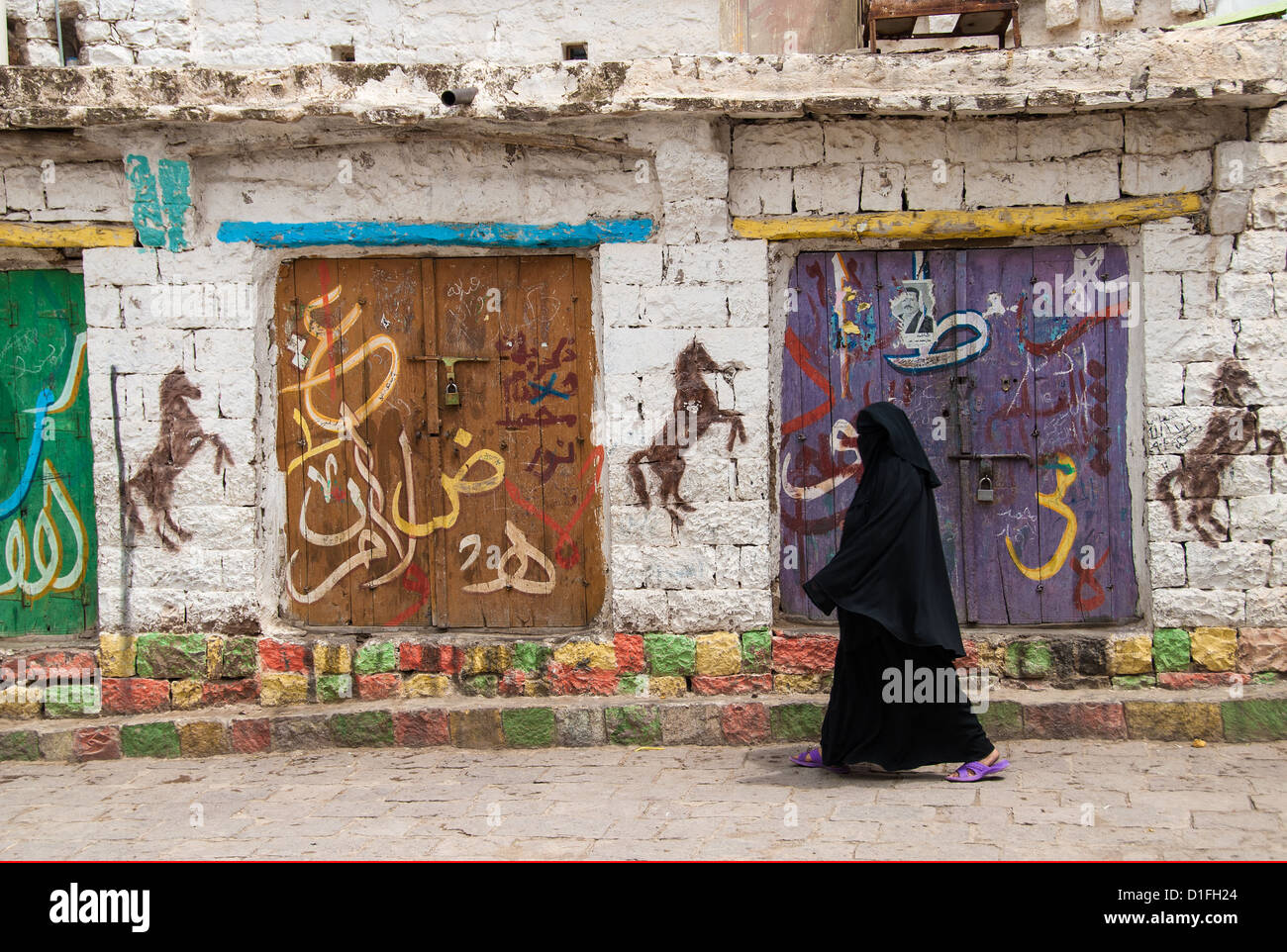 An unidentified woman walks in the street on May 10, 2007 in Ibb, Yemen ...