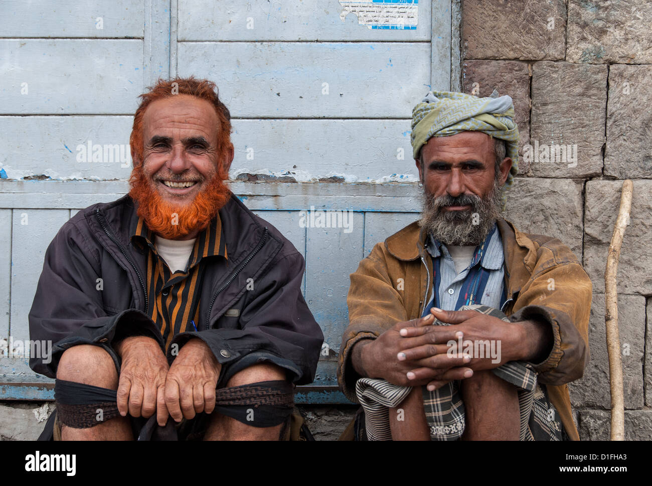 Two smiling men pose in front of a store on May 4, 2007 in Sanaa, Yemen. Stock Photo