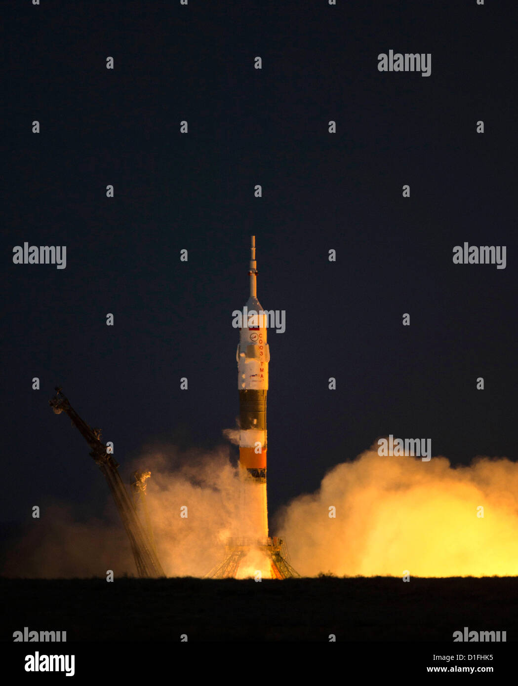 The Soyuz TMA-07M rocket launches from the Baikonur Cosmodrome December 19, 2012 in Kazakhstan. The rocket is carrying Expedition 34 NASA Flight Engineers Tom Marshburn, Soyuz Commander Roman Romanenko and Flight Engineer Chris Hadfield of the Canadian Space Agency (CSA) to the International Space Station. Stock Photo