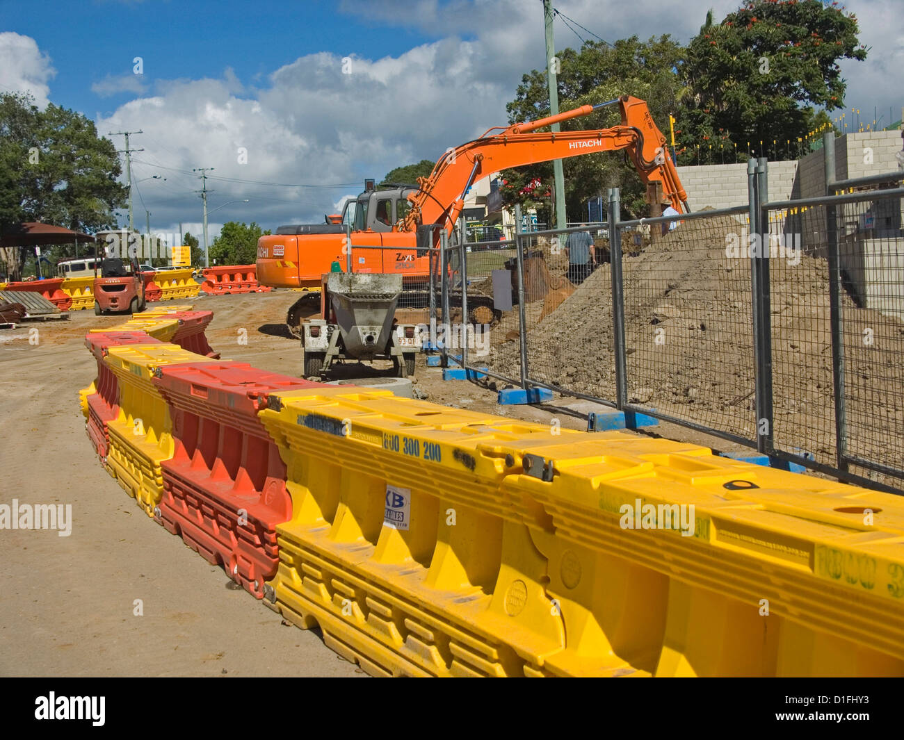 Orange and yellow plastic barriers at a building construction site