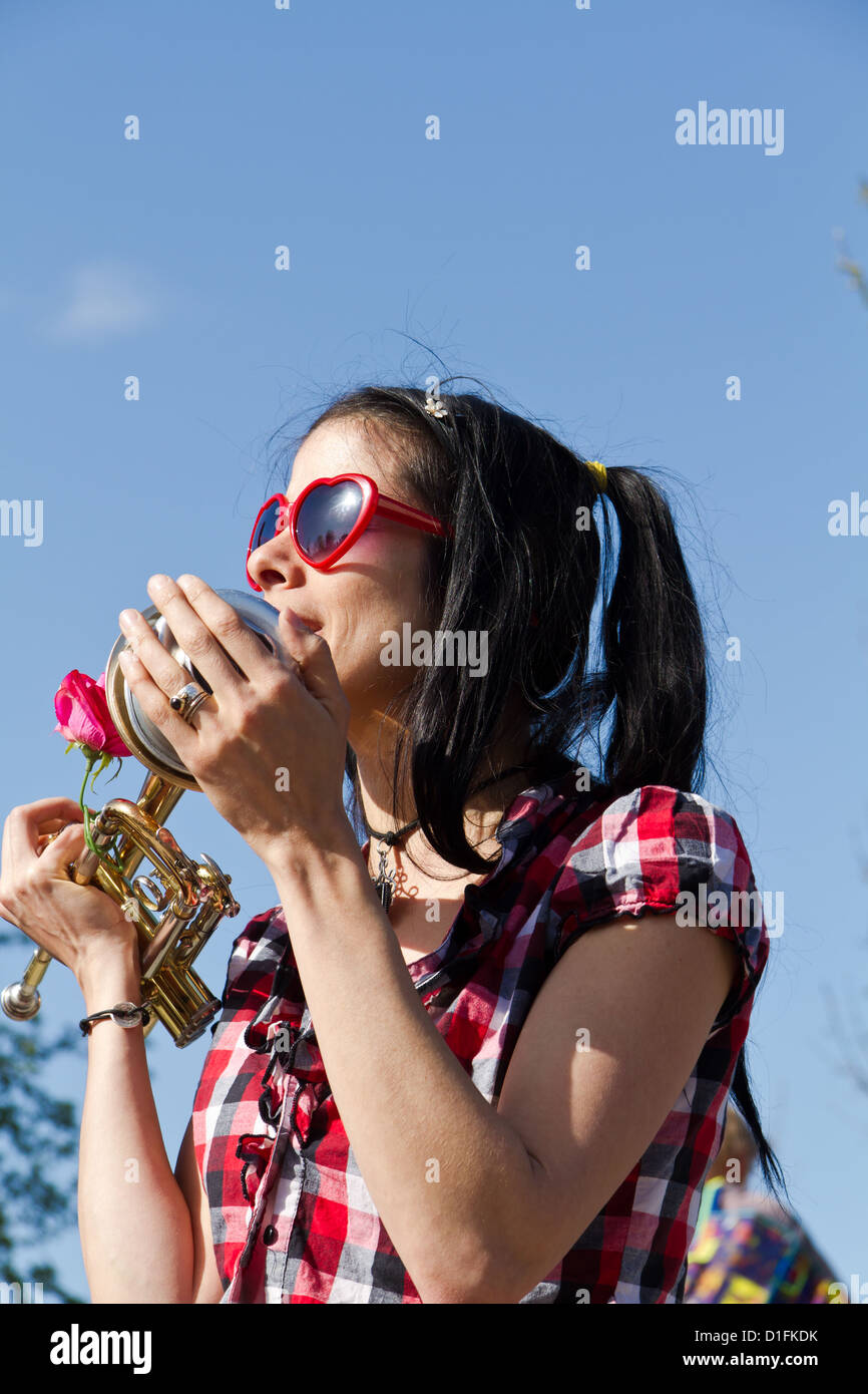 Young Street Musician playing a Trumpet in the Berlin Wall Park ( Mauerpark) in Berlin, Germany Stock Photo
