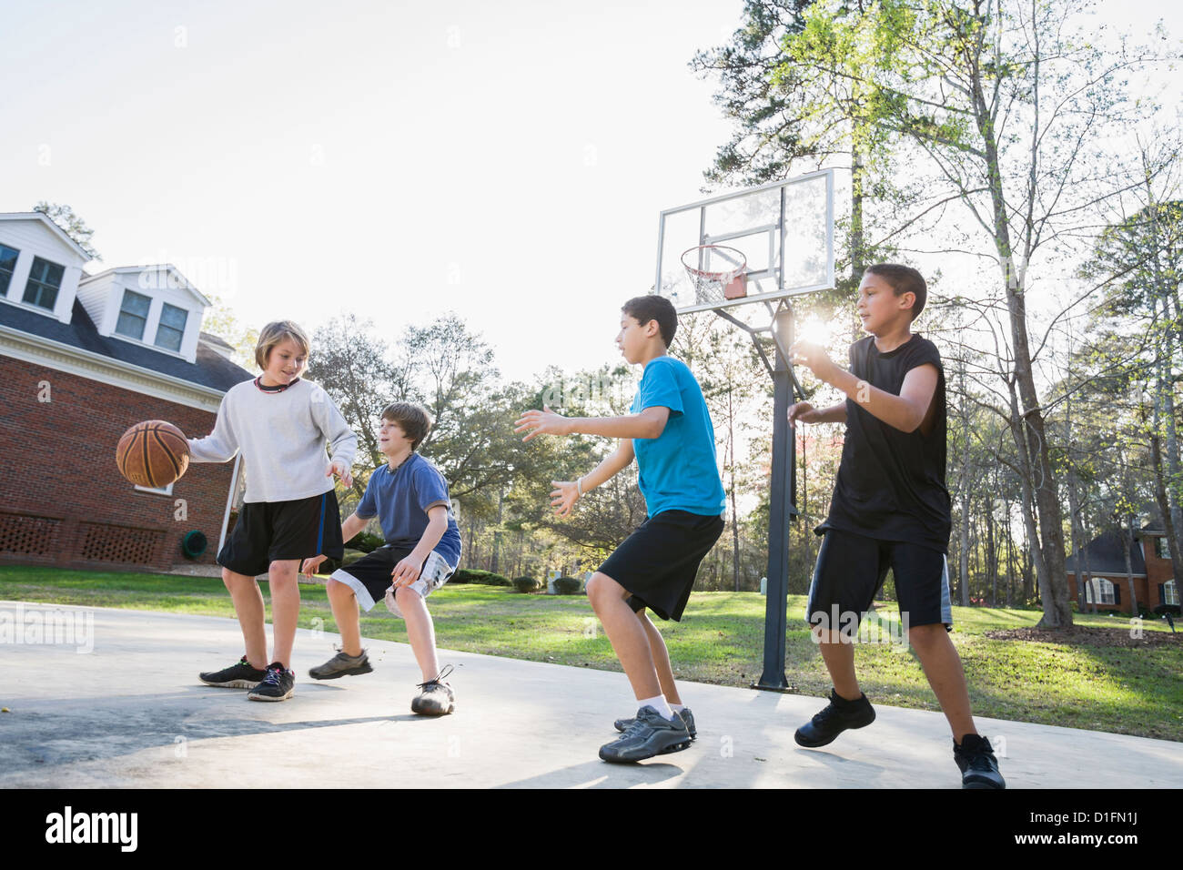 Boys playing basketball Stock Photo