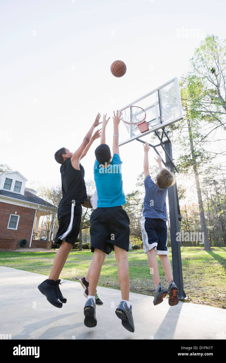 Boys playing basketball Stock Photo