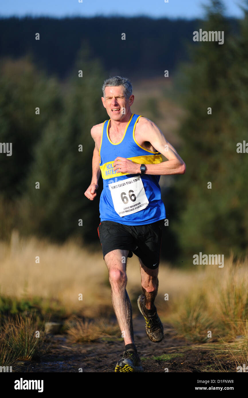 Man running in a trail race Stock Photo - Alamy