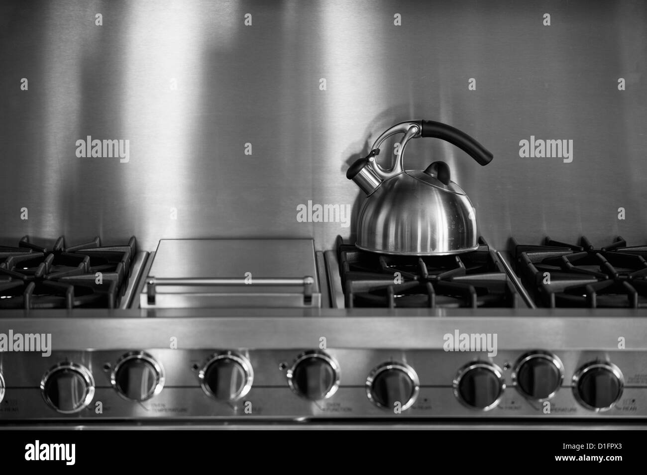 Tea Kettle on stainless steel oven; Irvine; California; USA Stock Photo