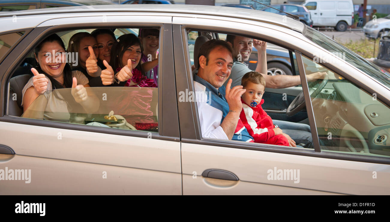 Happy family packed into a car in Palermo, Italy Stock Photo Alamy