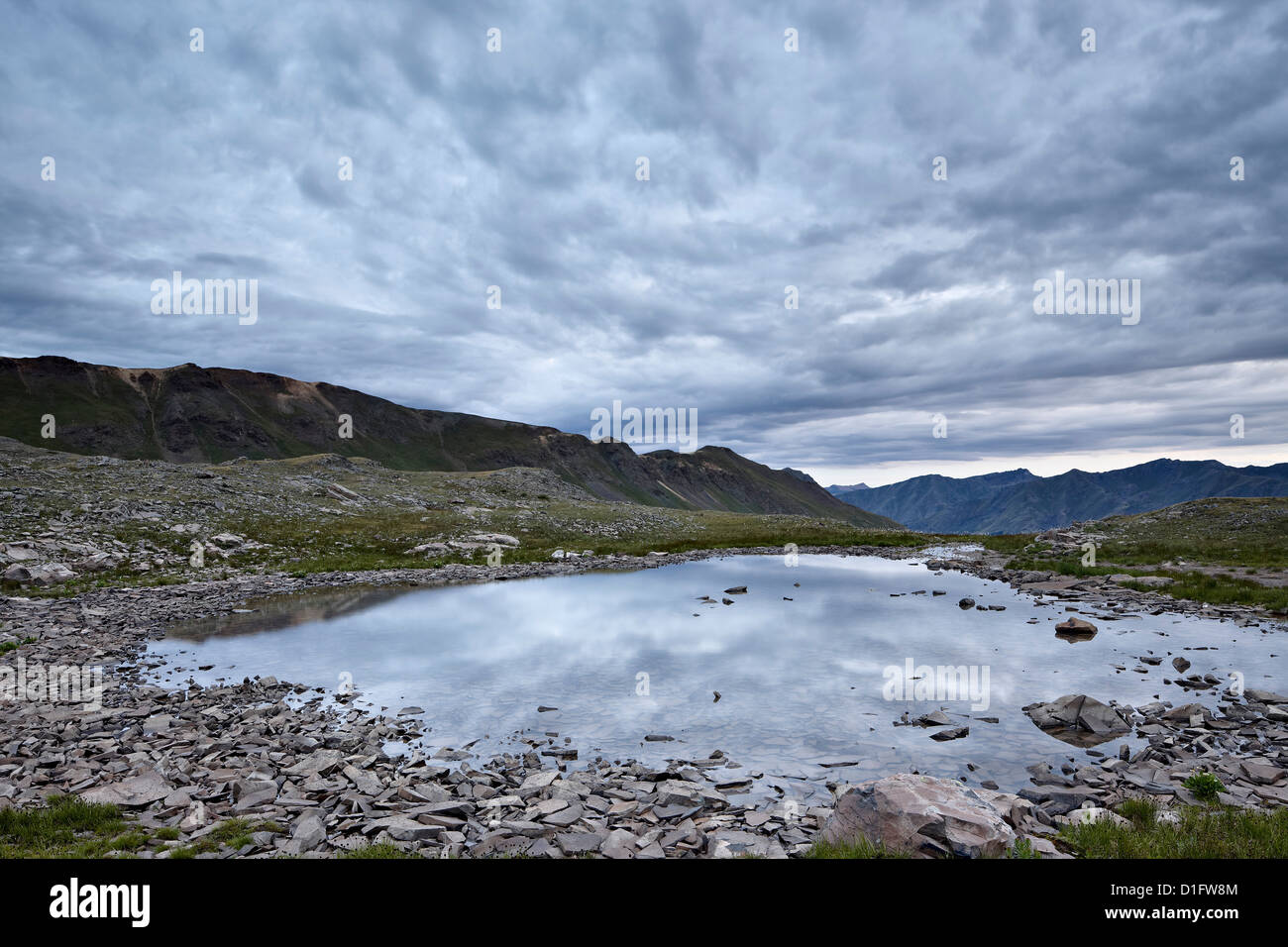 Clouds reflected in a tarn at Stony Pass, San Juan National Forest, Colorado, United States of America, North America Stock Photo