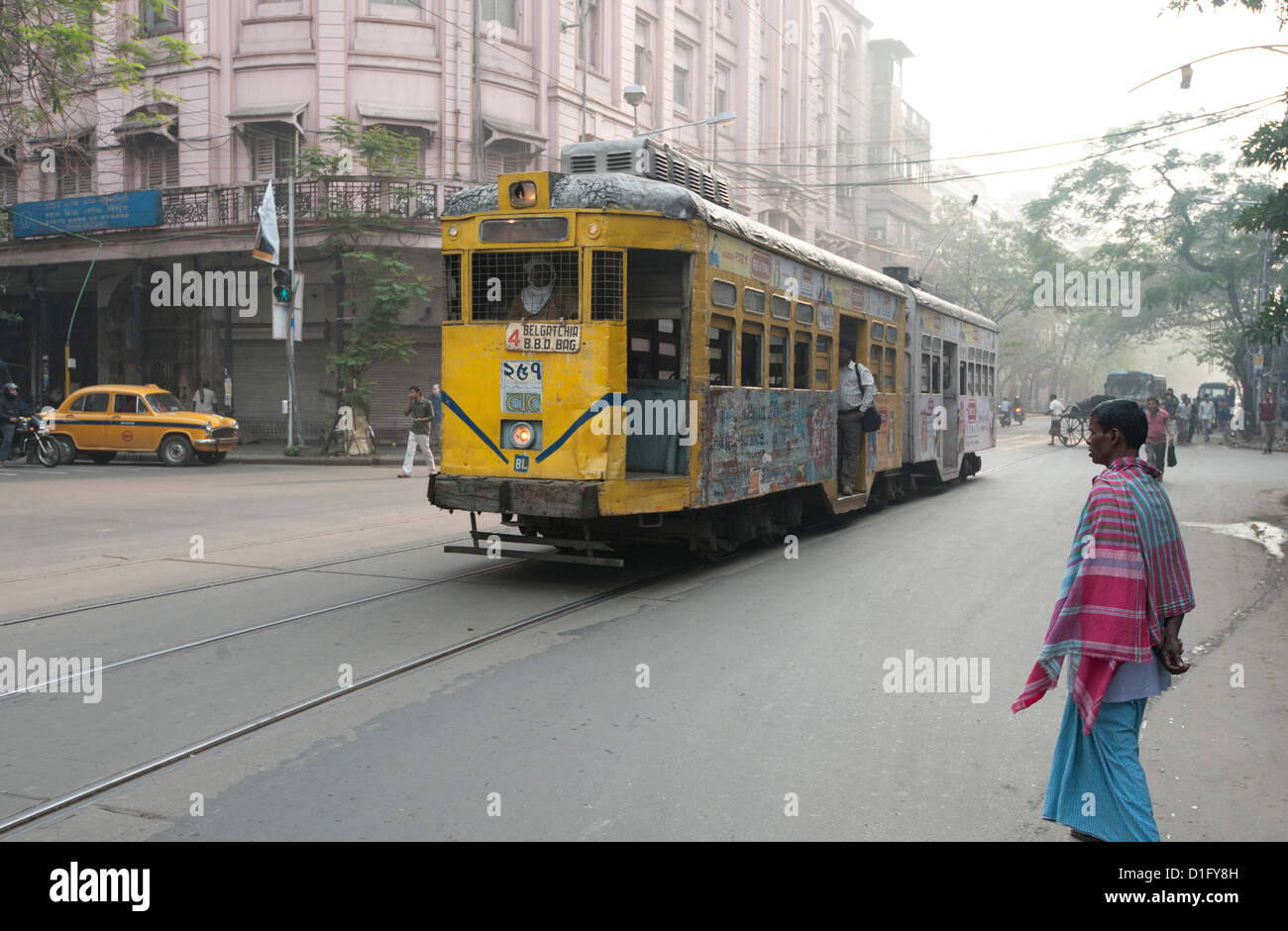 Kolkata traffic including street tram and taxi in the early morning