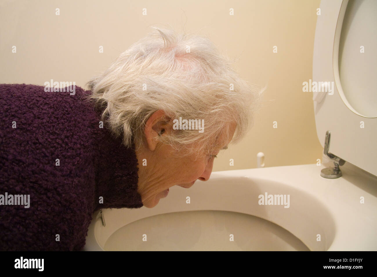 Woman vomiting into toilet hires stock photography and images Alamy