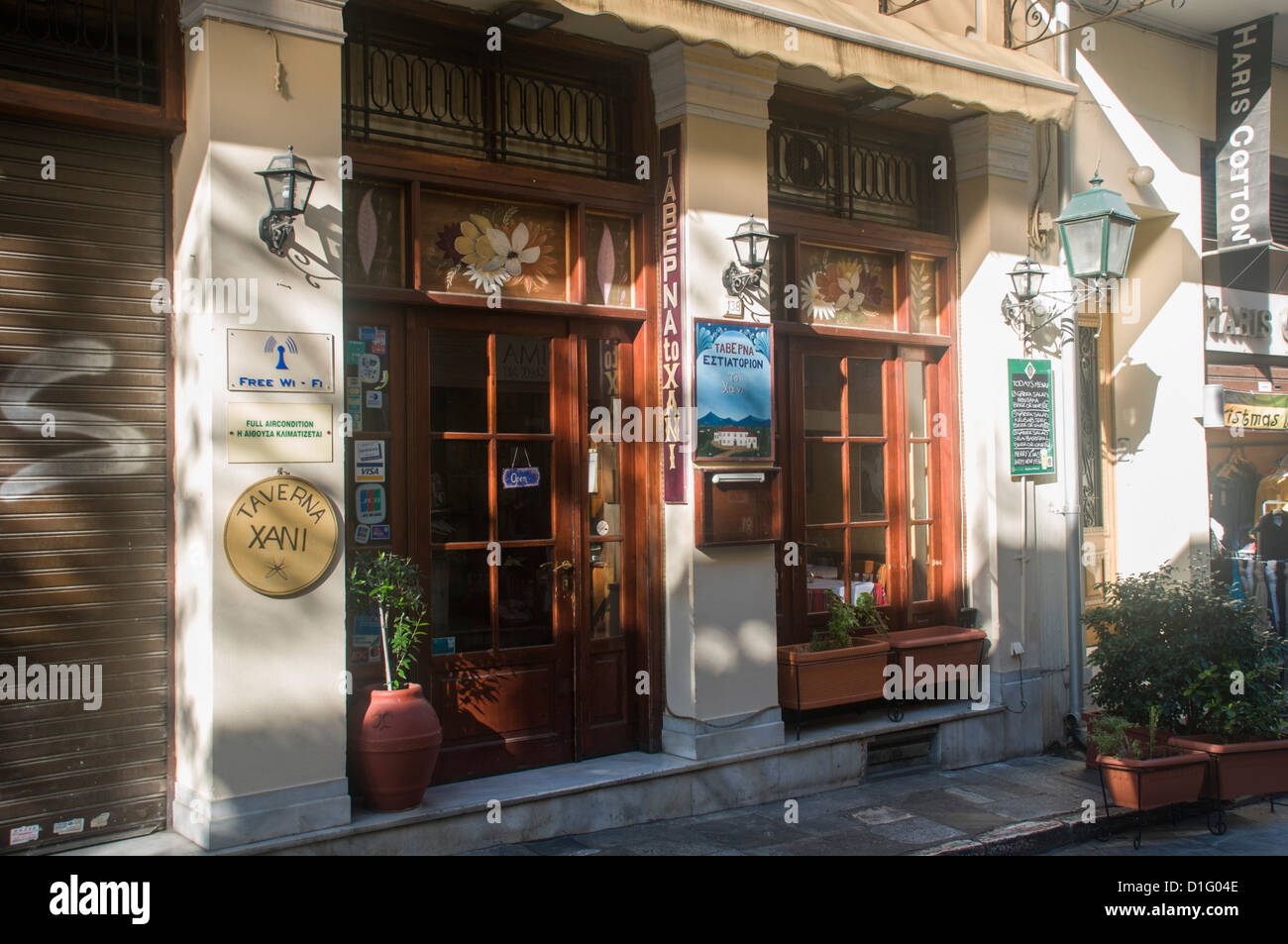 A Taverna sign in Greek in the Narrow Mnisikleous street, Plaka, Athens, Greece Stock Photo