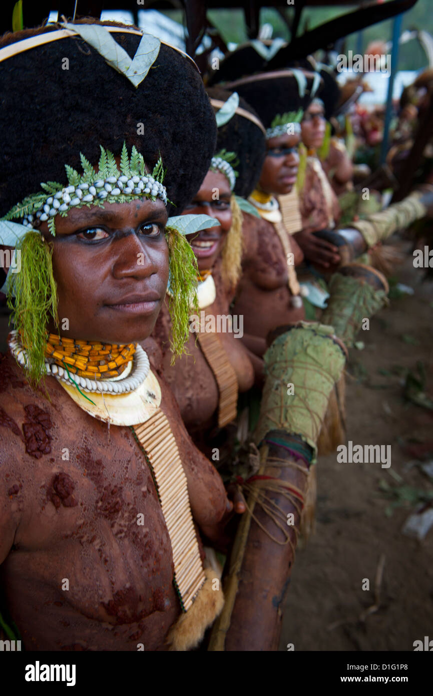 Colourfully dressed and face painted local tribes celebrating the traditional Sing Sing in the Highlands, Papua New Guinea Stock Photo