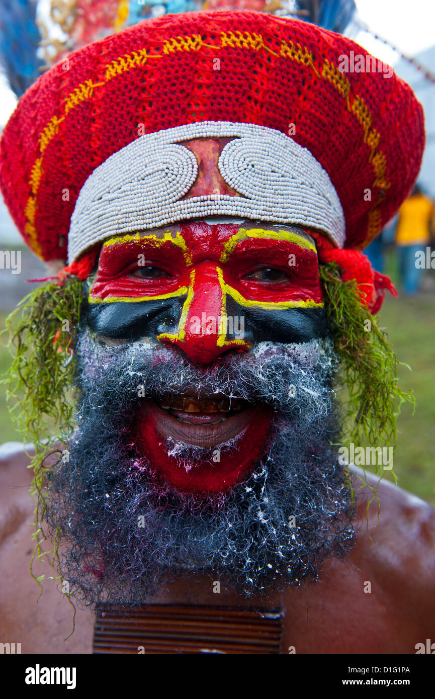 Colourfully dressed and face painted local tribesman celebrating the traditional Sing Sing in the Highlands, Papua New Guinea Stock Photo