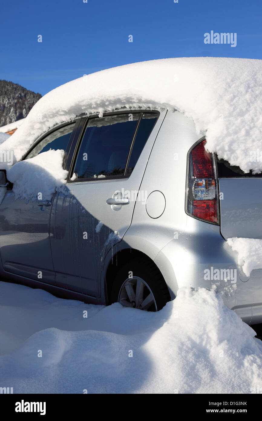 car covered by heavy snow. Photo by Willy Matheisl Stock Photo