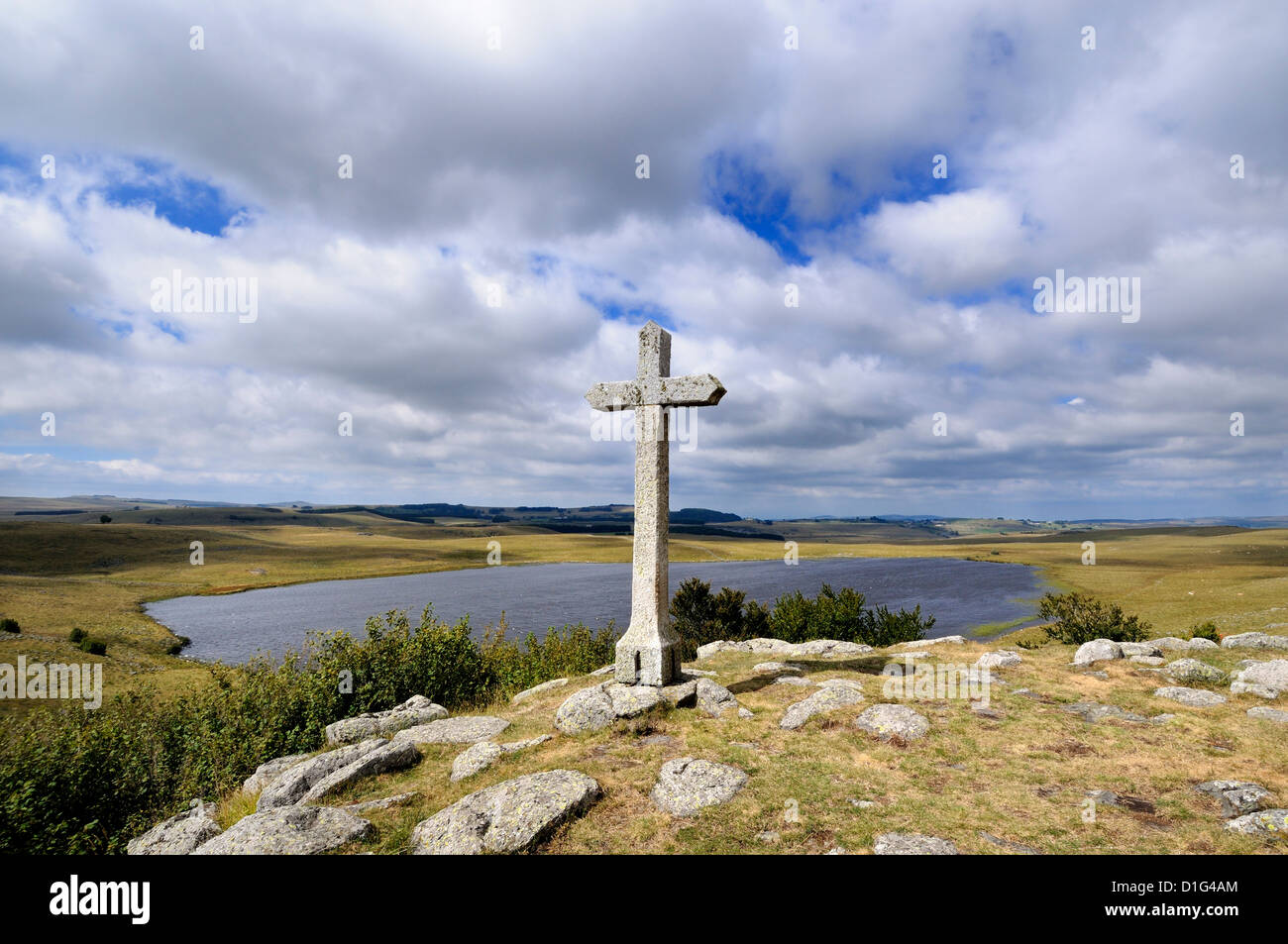 Cross at St Andeol lake on the Way of St James in Lozere, Aubrac, France, Europe - pilgrimage route to Santiago de Compostela Stock Photo
