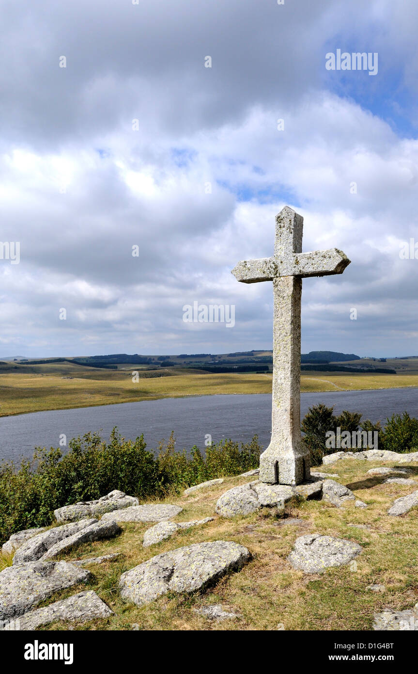 Cross at St Andeol lake on the Way of St James in Lozere, Aubrac, France, Europe - pilgrimage route to Santiago de Compostela Stock Photo