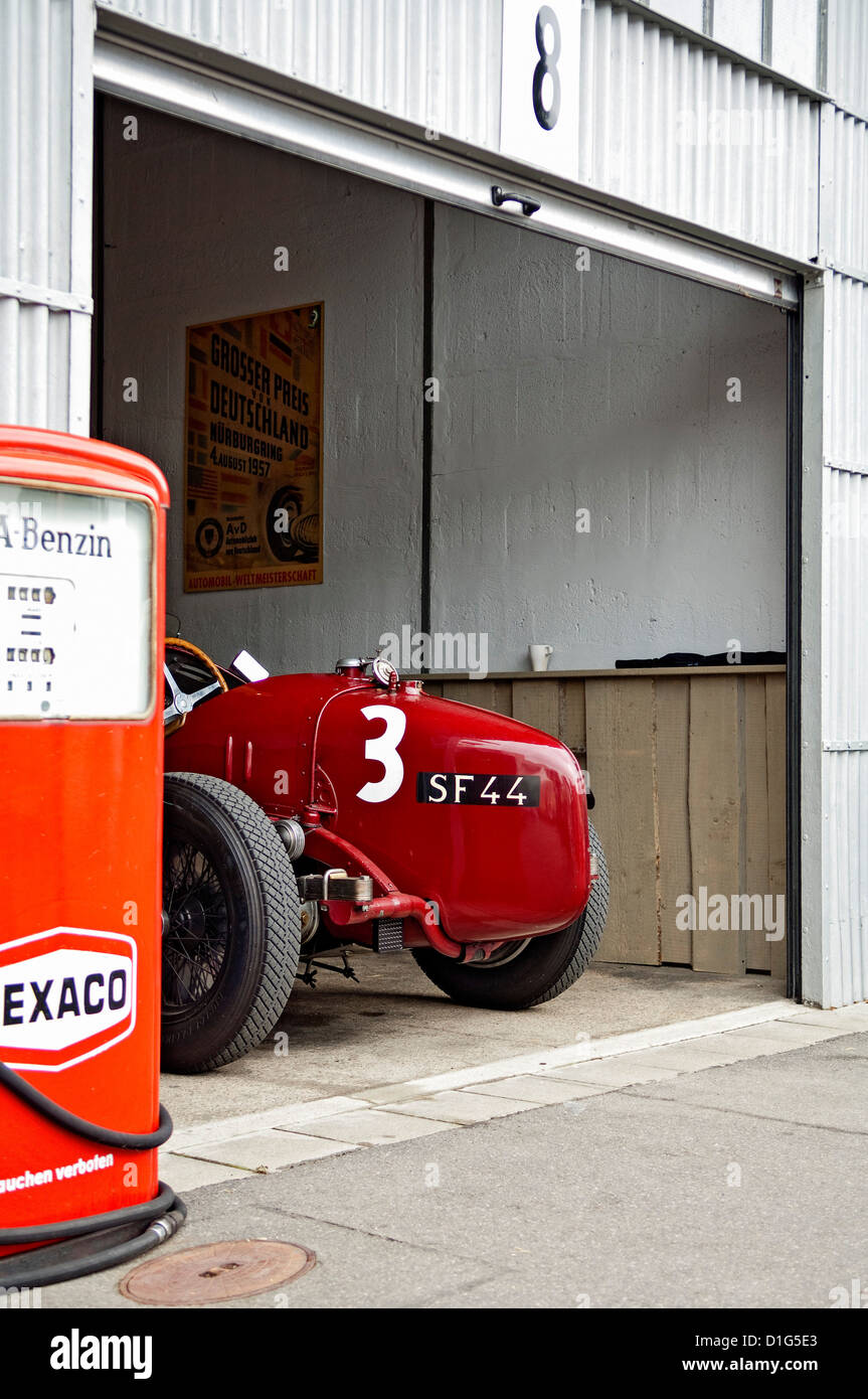 Historic Race car in garage with Texaco petrol pump at OGP Nürburgring 2011 Stock Photo