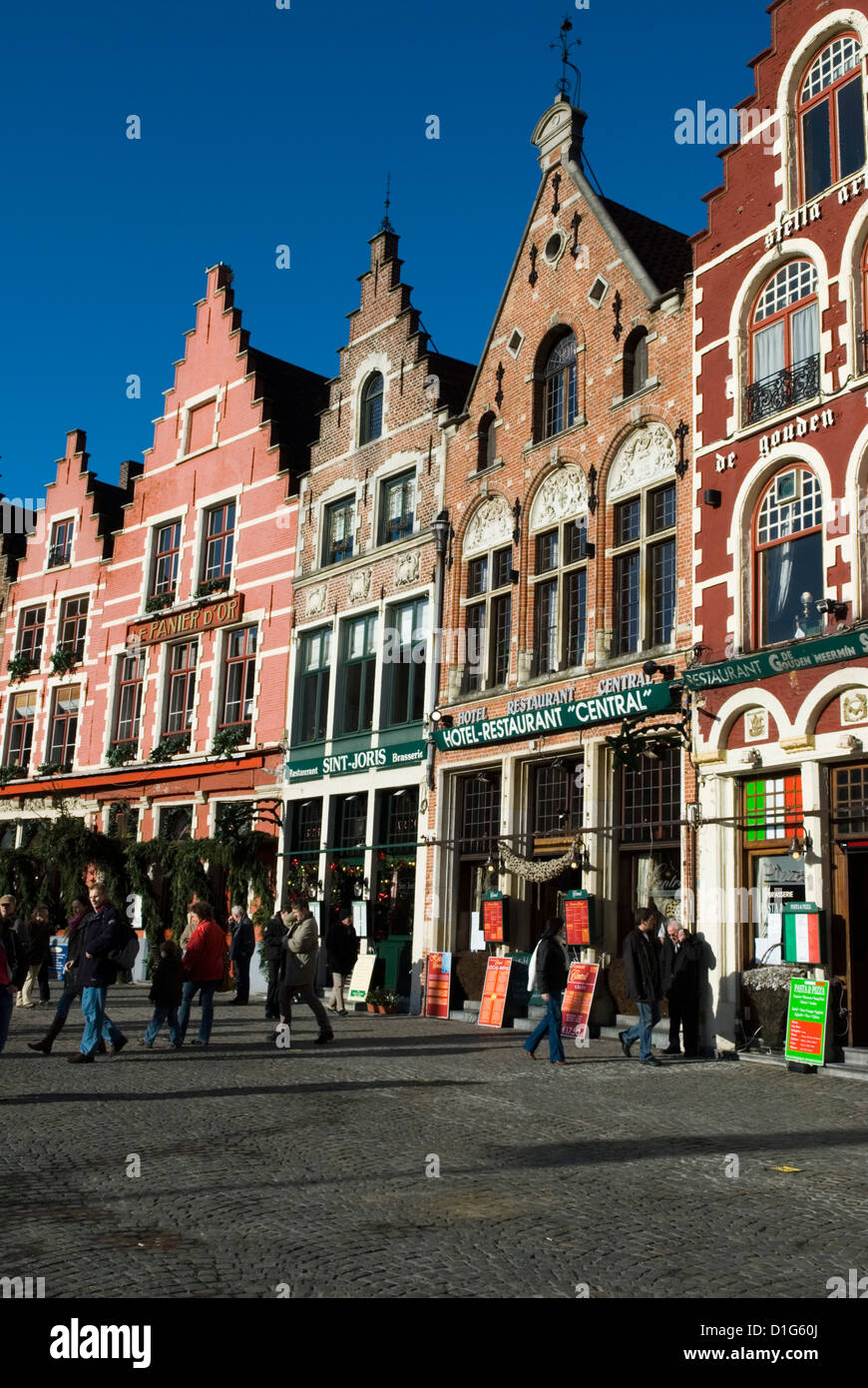 Gabled fronted restaurants in the Market Square at Christmas, Bruges, West Vlaanderen (Flanders), Belgium, Europe Stock Photo