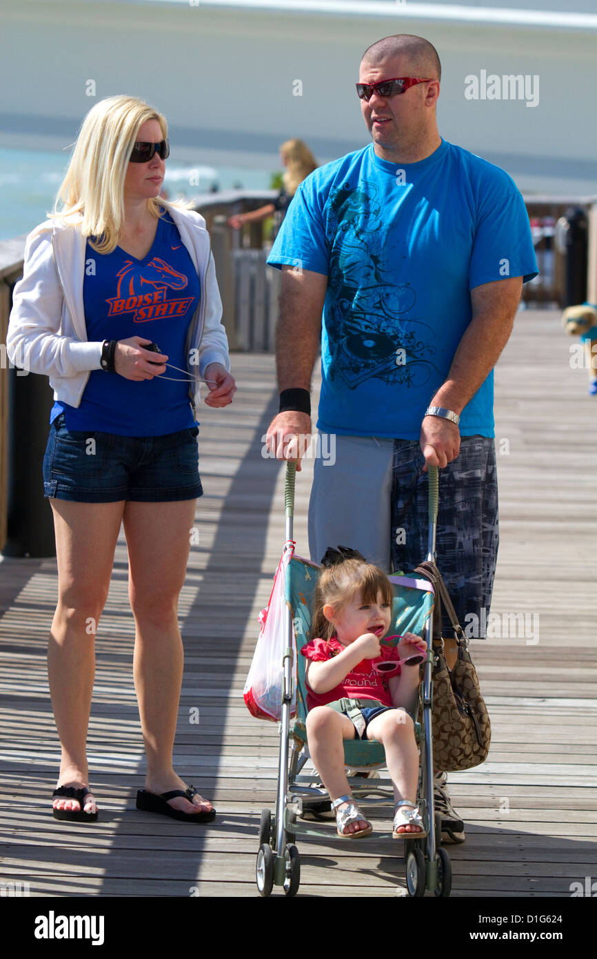 Family on the boardwalk at Johns Pass Village located on the waterfront at Madeira Beach, Florida, USA. Stock Photo