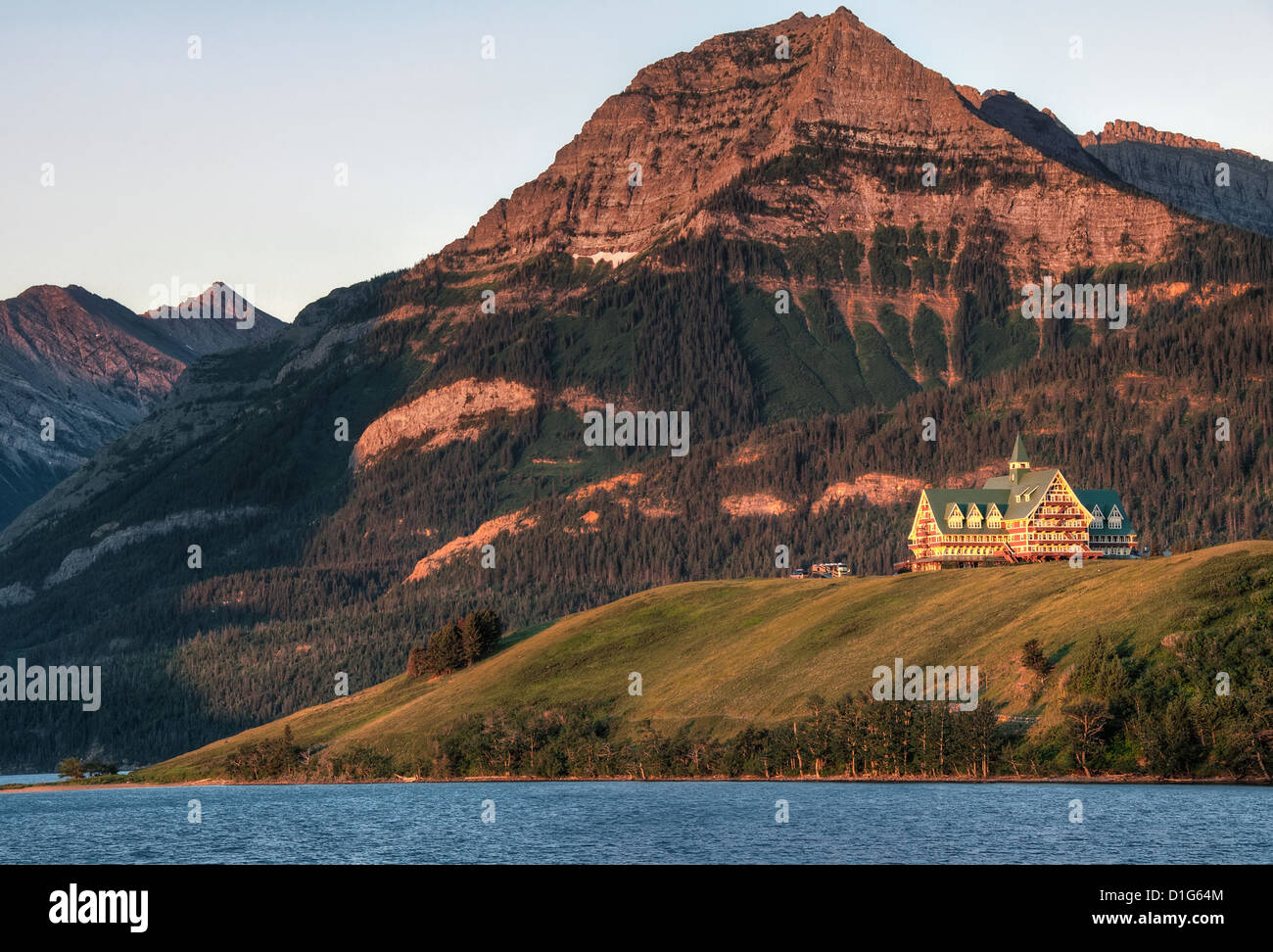 Taken right at sunrise as the orange morning sun lite the mountain and hotel. Stock Photo