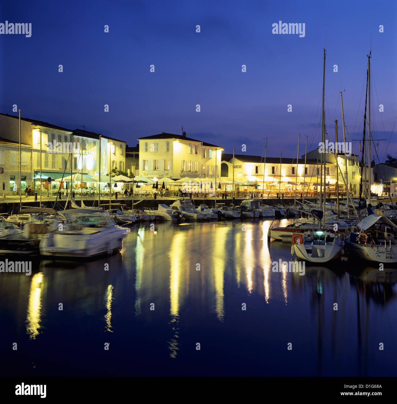 The harbour with restaurants at dusk, St. Martin, Ile de Re, Poitou-Charentes, France, Europe Stock Photo