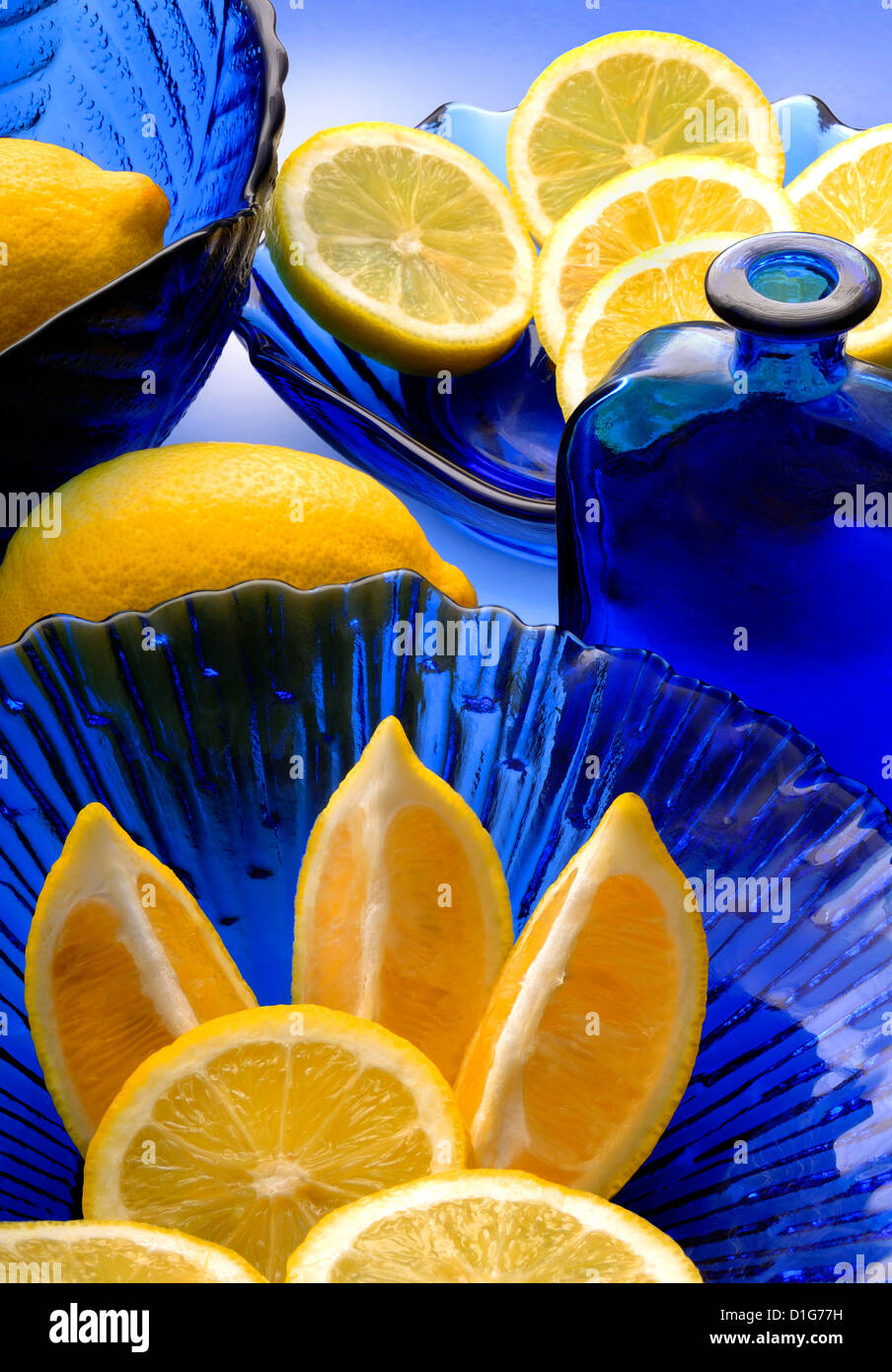 blue glass and lemons Stock Photo Alamy
