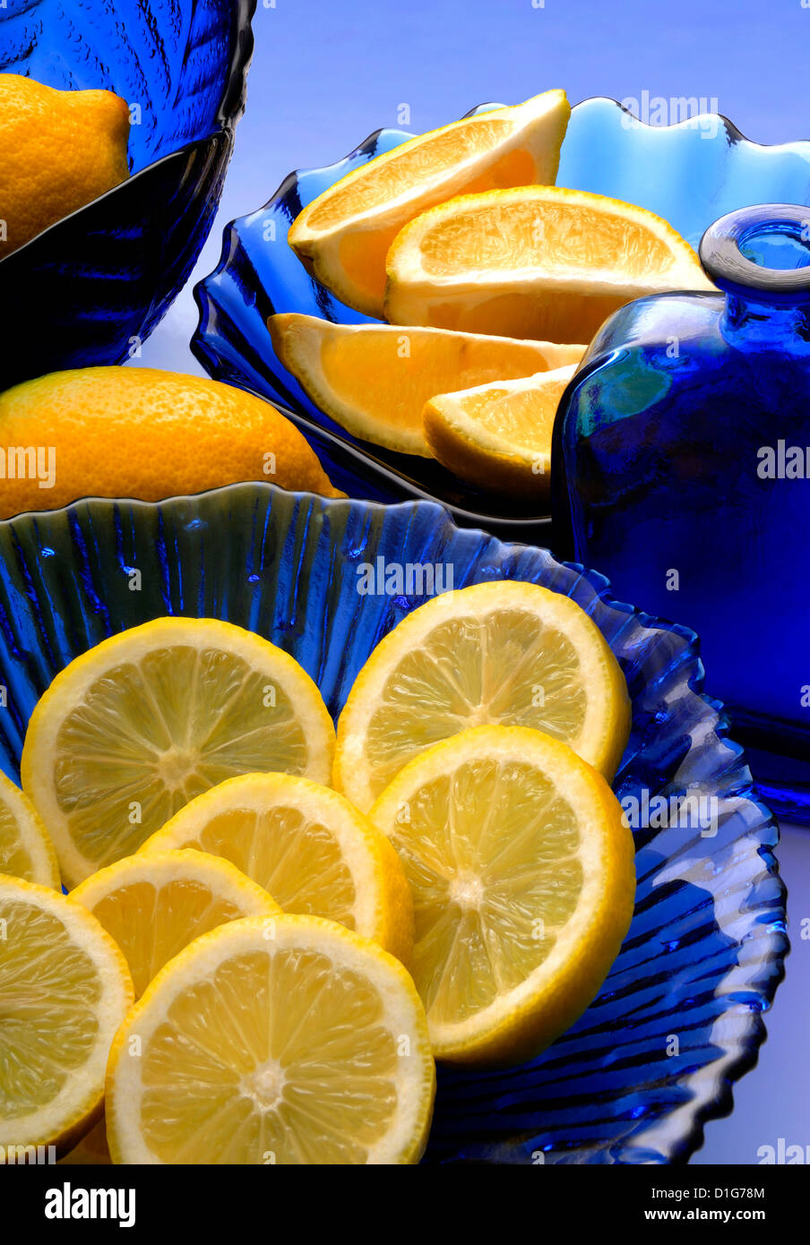 blue glass and lemons Stock Photo Alamy