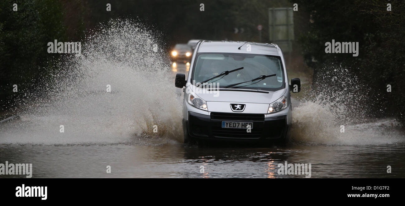 Vehicles negotiate flooded roads near Henfield in West Sussex after torrential rain. Picture by James Boardman Stock Photo