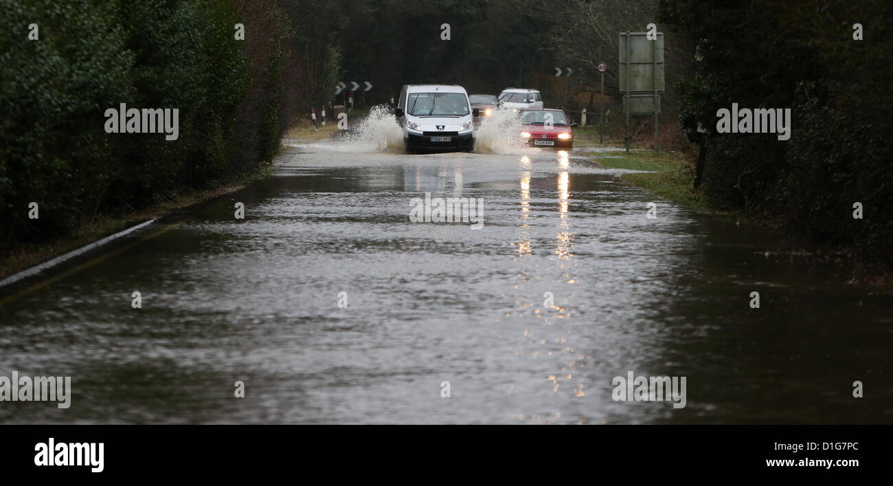 Vehicles negotiate flooded roads near Henfield in West Sussex after torrential rain. Picture by James Boardman Stock Photo