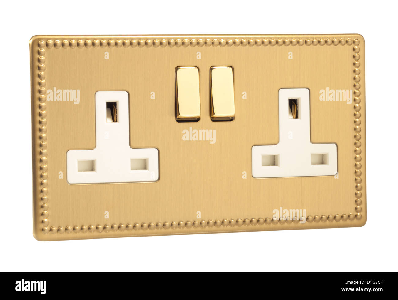 Brass double UK electrical power socket with switches. Stock Photo