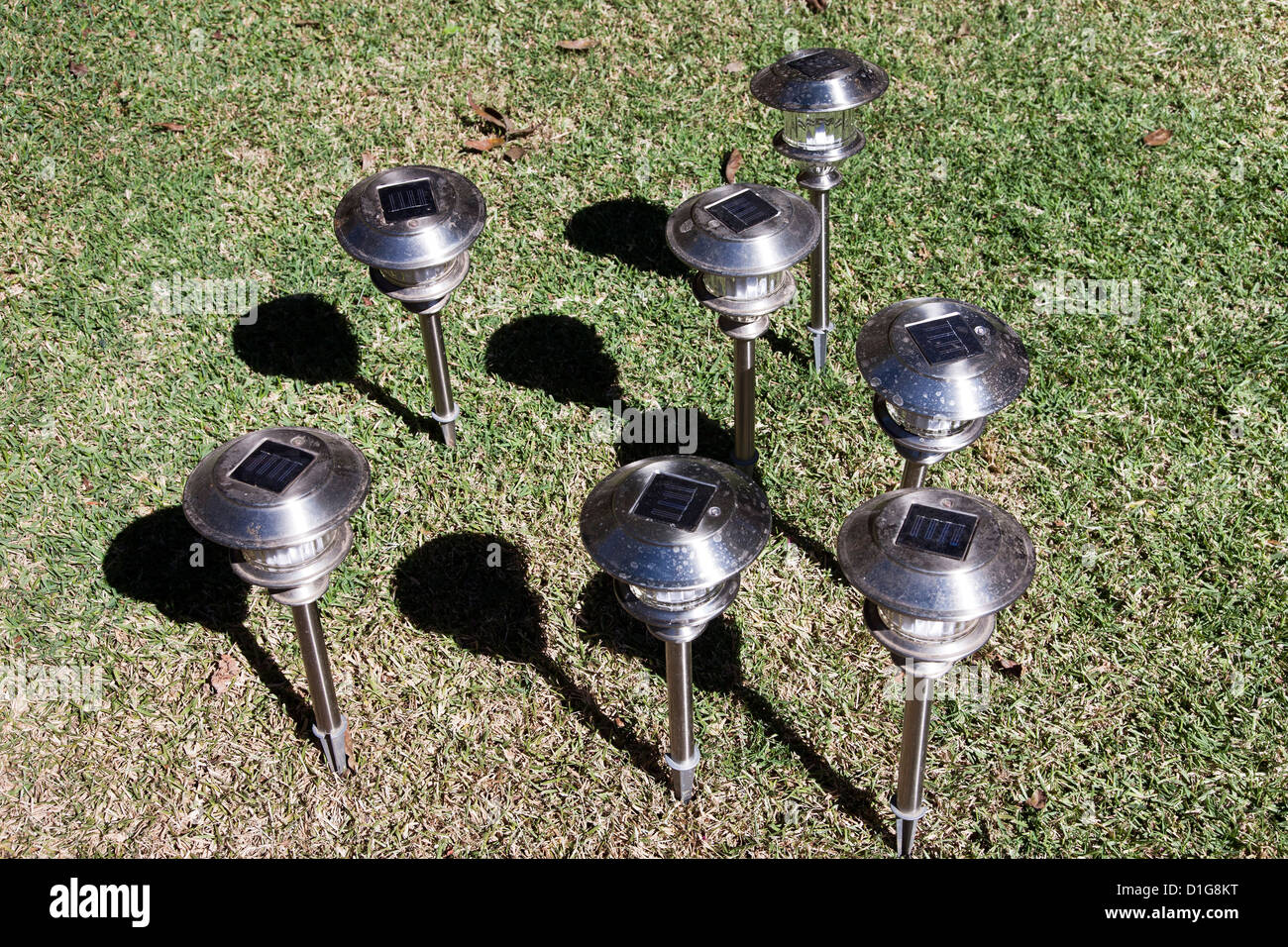 solar garden pathway light lights lighting being recharged in the sun